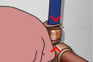 2. Squeeze the tongs to press the release collar of the fitting