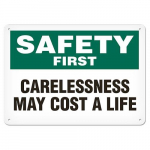Sign "Safety First - Carelessness May Cost Life"_noscript